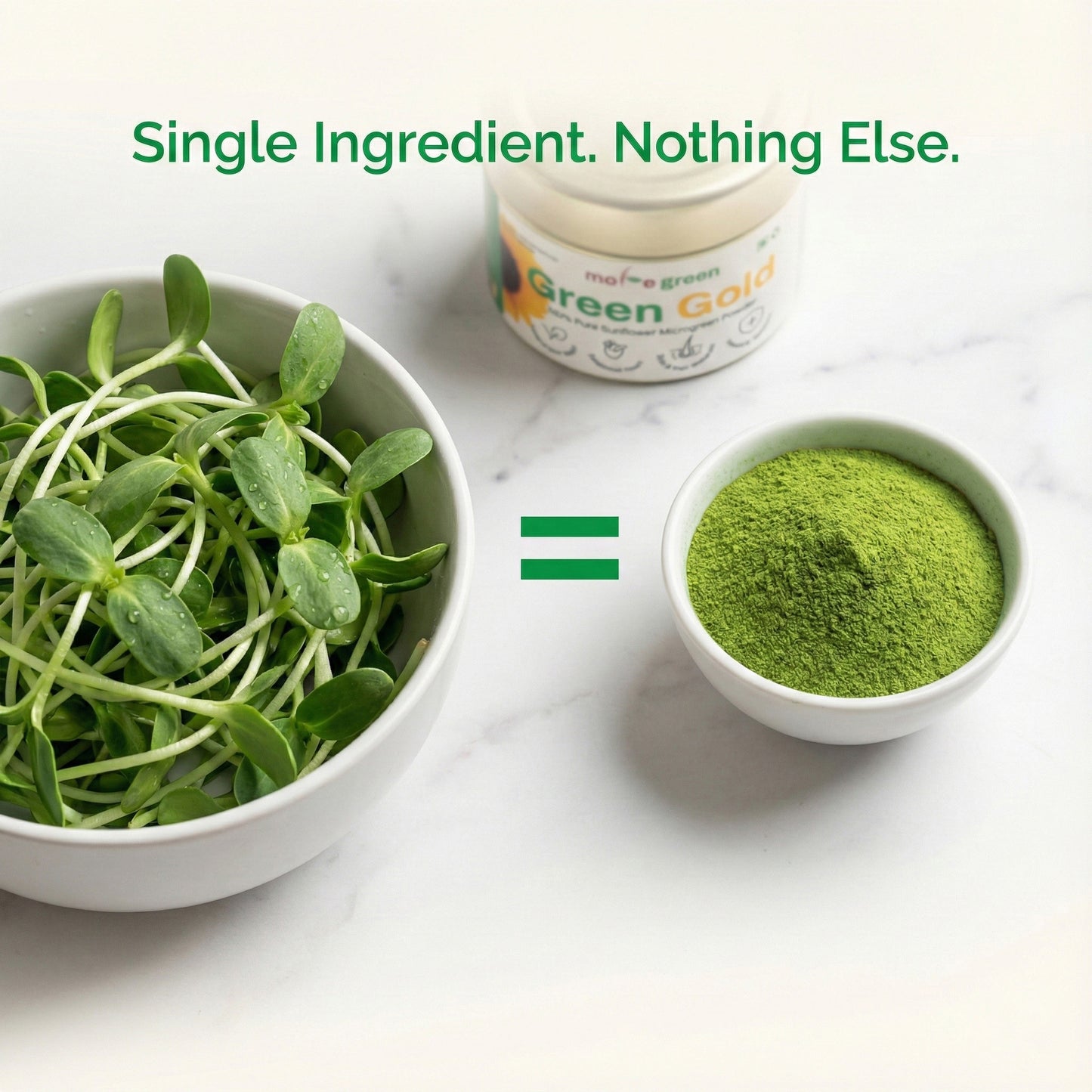 Bowl of green leafy vegetables and a container labeled 'Green Gold' on a white surface.